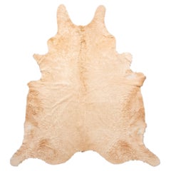 Rug & Kilim’s Contemporary Cowhide Rug in Cream