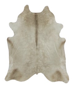Rug & Kilim’s Contemporary Cowhide Rug in Soft Beige & Brown Tones
