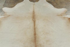 Rug & Kilim’s Contemporary Cowhide Rug in Warm Beige & Brown Accents