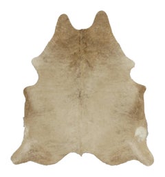 Rug & Kilim’s Contemporary Cowhide Rug in Warm Beige & Brown Accents