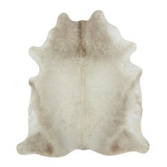 Rug & Kilim’s Contemporary Cowhide Rug in Warm Beige & Brown Tones