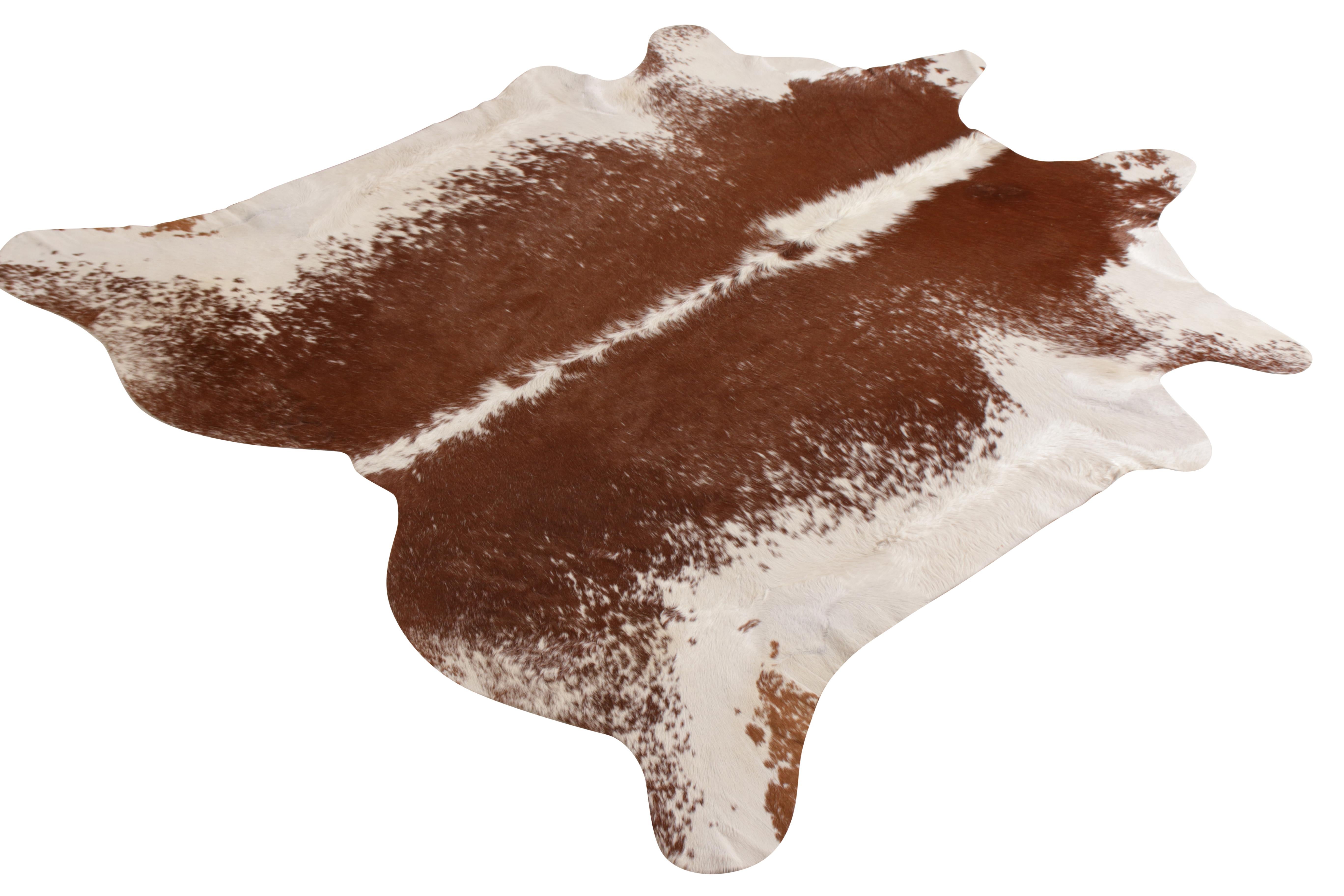 A 7x7 from Rug & Kilim’s line of handmade cowhide rugs. Enjoying a silky, lustrous sheen complementing the pallet of white and brown with cream accents. A comfortable, textural choice, particularly well suited to country homes and rustic interiors.
