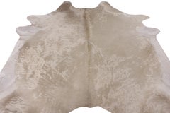 Rug & Kilim’s Contemporary Cowhide Rug in White and Rose Gold