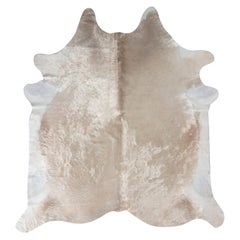 Rug & Kilim’s Contemporary Cowhide Rug in White and Rose Gold