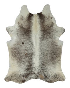 Rug & Kilim’s Contemporary Cowhide Rug with Natural Speckles in Black & White