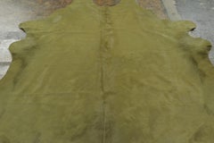 Rug & Kilim’s Contemporary Cowhide Solid Rug in Sage Green Hues