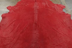 Rug & Kilim’s Contemporary Cowhide Solid Rug in Vibrant Red Hues