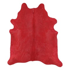 Rug & Kilim’s Contemporary Cowhide Solid Rug in Vibrant Red Hues