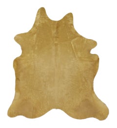Rug & Kilim’s Contemporary Cowhide Solid Rug in Warm Camel Hues