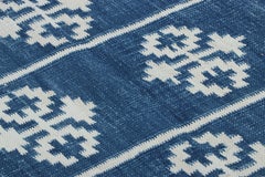 Rug & Kilim’s Contemporary Dhurrie Rug in Blue with White Geometric Medallions