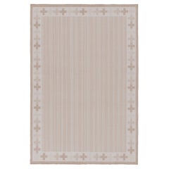 Rug & Kilim’s Contemporary Dhurrie Rug in Cream and Beige Pinstripes