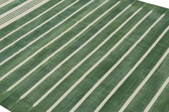 Rug & Kilim’s Contemporary Dhurrie Rug in Green and Off-White Stripes