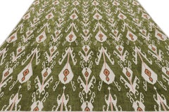 Rug & Kilim’s Contemporary Dhurrie Rug in Green with White & Pink Ikats Pattern