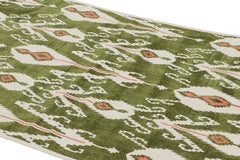 Rug & Kilim’s Contemporary Dhurrie Rug in Green with White & Pink Ikats Patterns