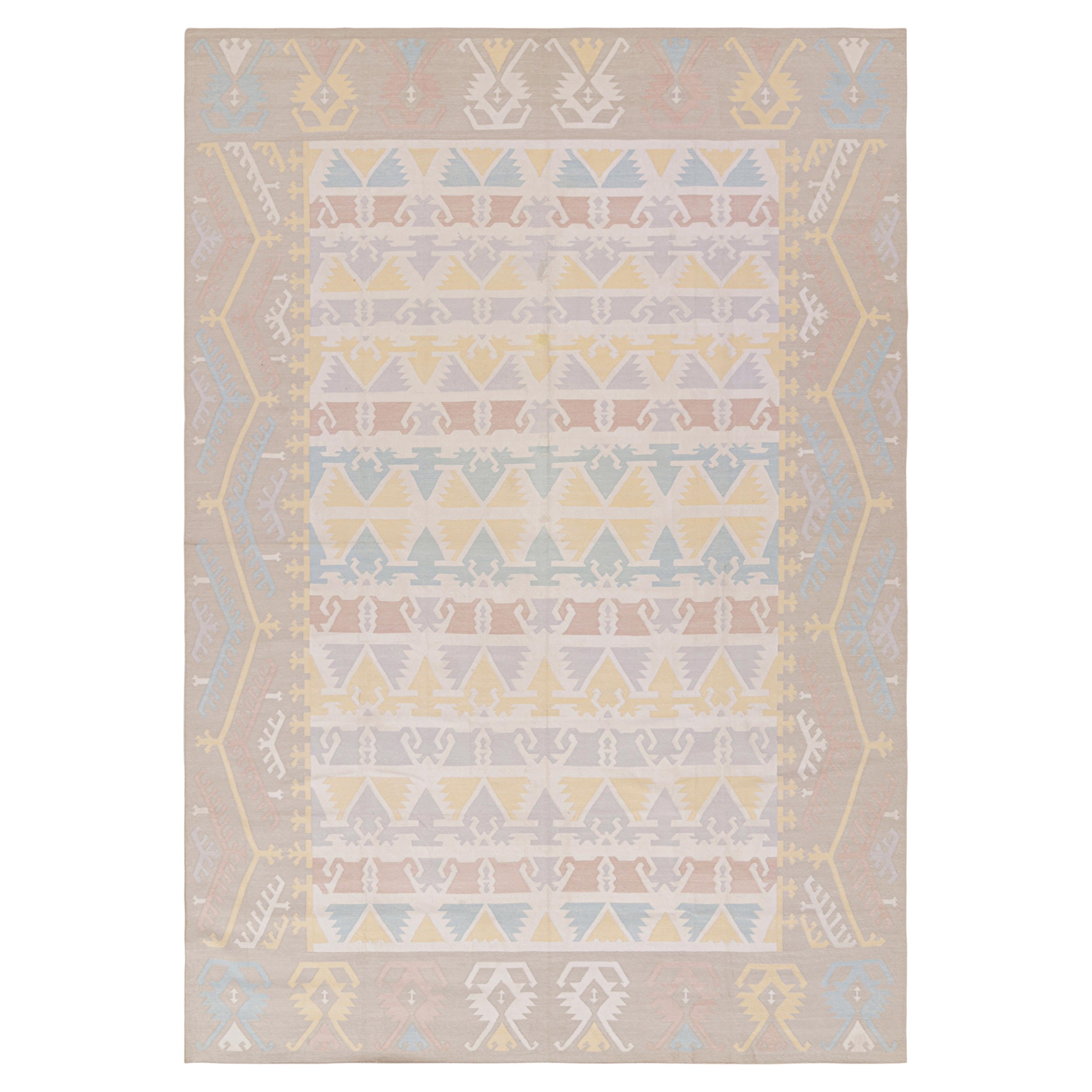 Rug & Kilim’s Contemporary Dhurrie Rug in Pastels and Geometric Patterns