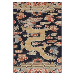 Rug & Kilim’s Contemporary Dragon Rug in Navy Blue with Gold Pictorial