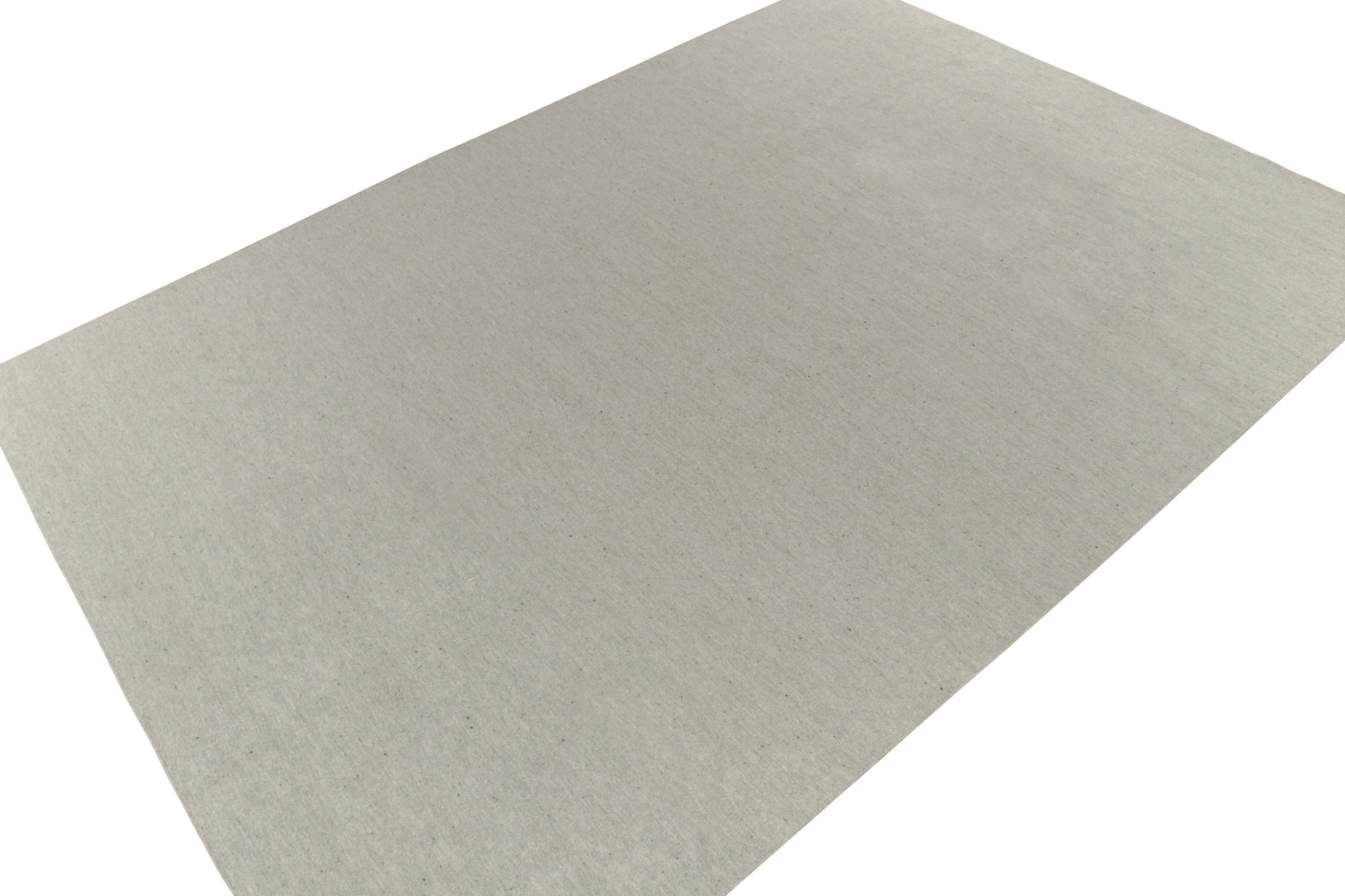 From Rug & Kilim’s contemporary works, a 10x15 modern flat weave hand-woven from a fine Alpaca yarn. The simple & beautiful tones of grey & white play gently in a mild element of striation, complementing the softness of Alpaca yarn and the simple