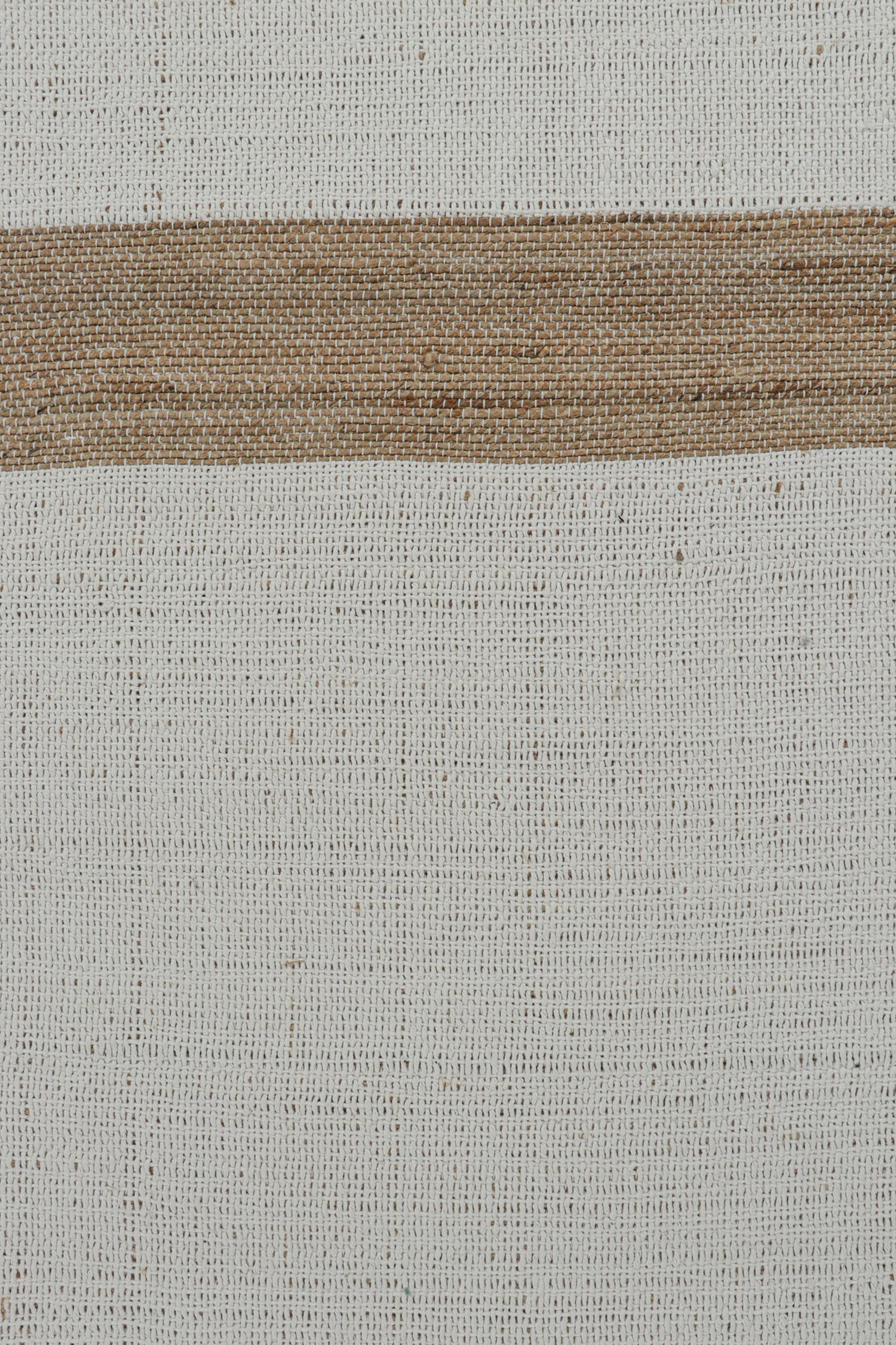 This 10x14 Kilim is the next of a bold new line of contemporary flatweaves by Rug & Kilim.
Further On the Design:
This all-natural Kilim employs handwoven jute and in a cozy play of neutral tones. This edition enjoys soft beige-brown borders and