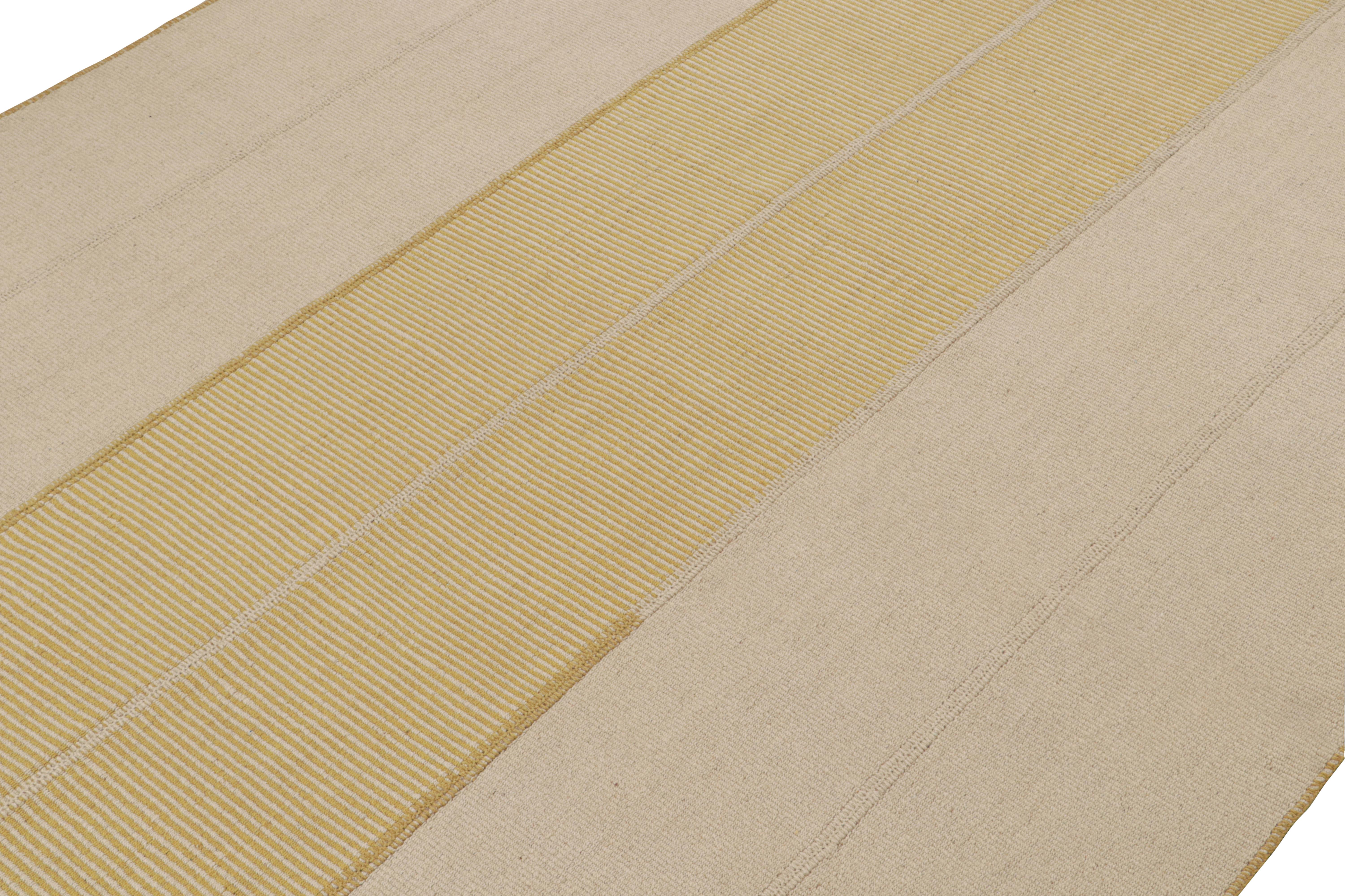 Handwoven in wool, a 10x14 Kilim from a bold new line of contemporary flatweaves by Rug & Kilim.

On the Design: 

Connoting a modern take on classic panel-weaving, our latest “Rez Kilim” enjoys beige & gold tones. Keen eyes will admire how this