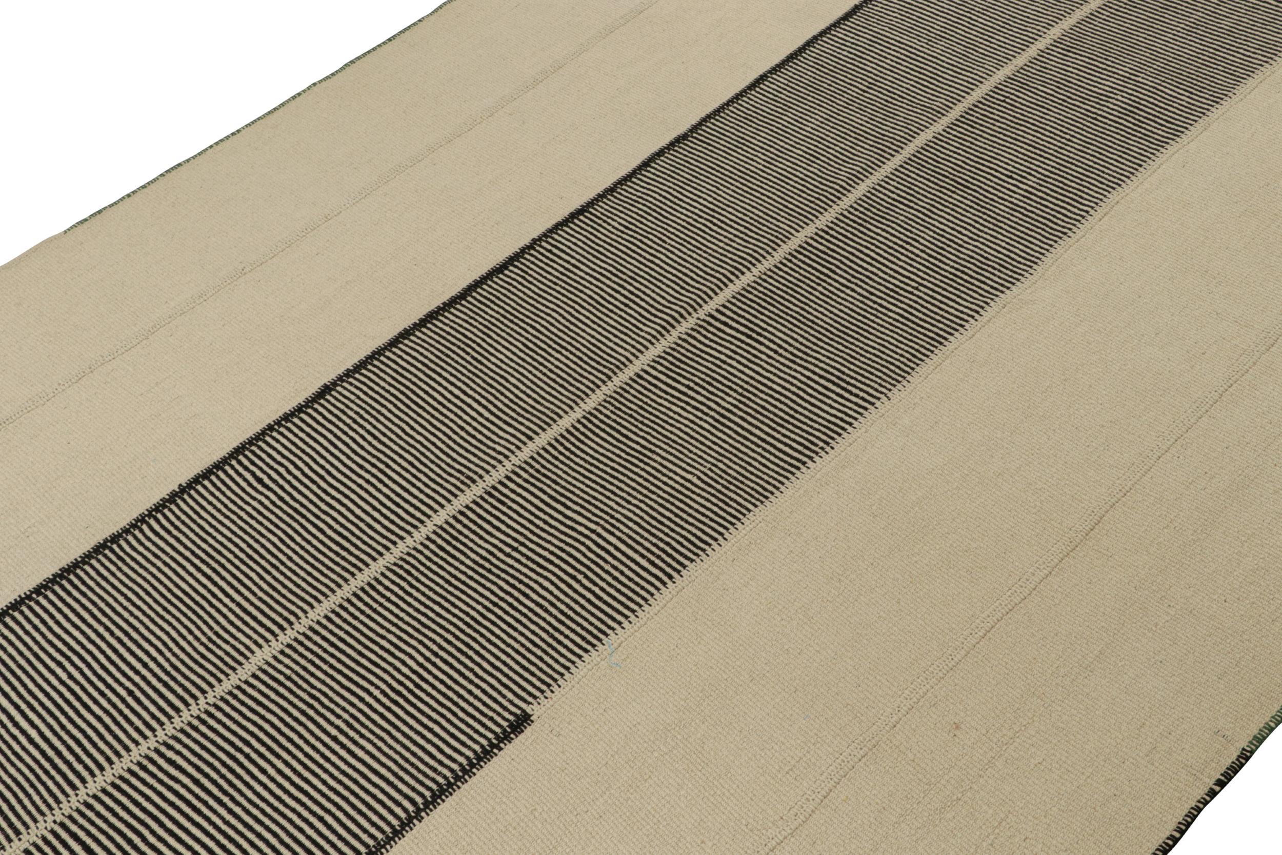 Handwoven in wool, a 10x14 Kilim from a bold new line of contemporary flatweaves by Rug & Kilim.

On the Design: 

Connoting a modern take on classic panel-weaving, our latest “Rez Kilim” enjoys beige and black tones. Keen eyes will admire how