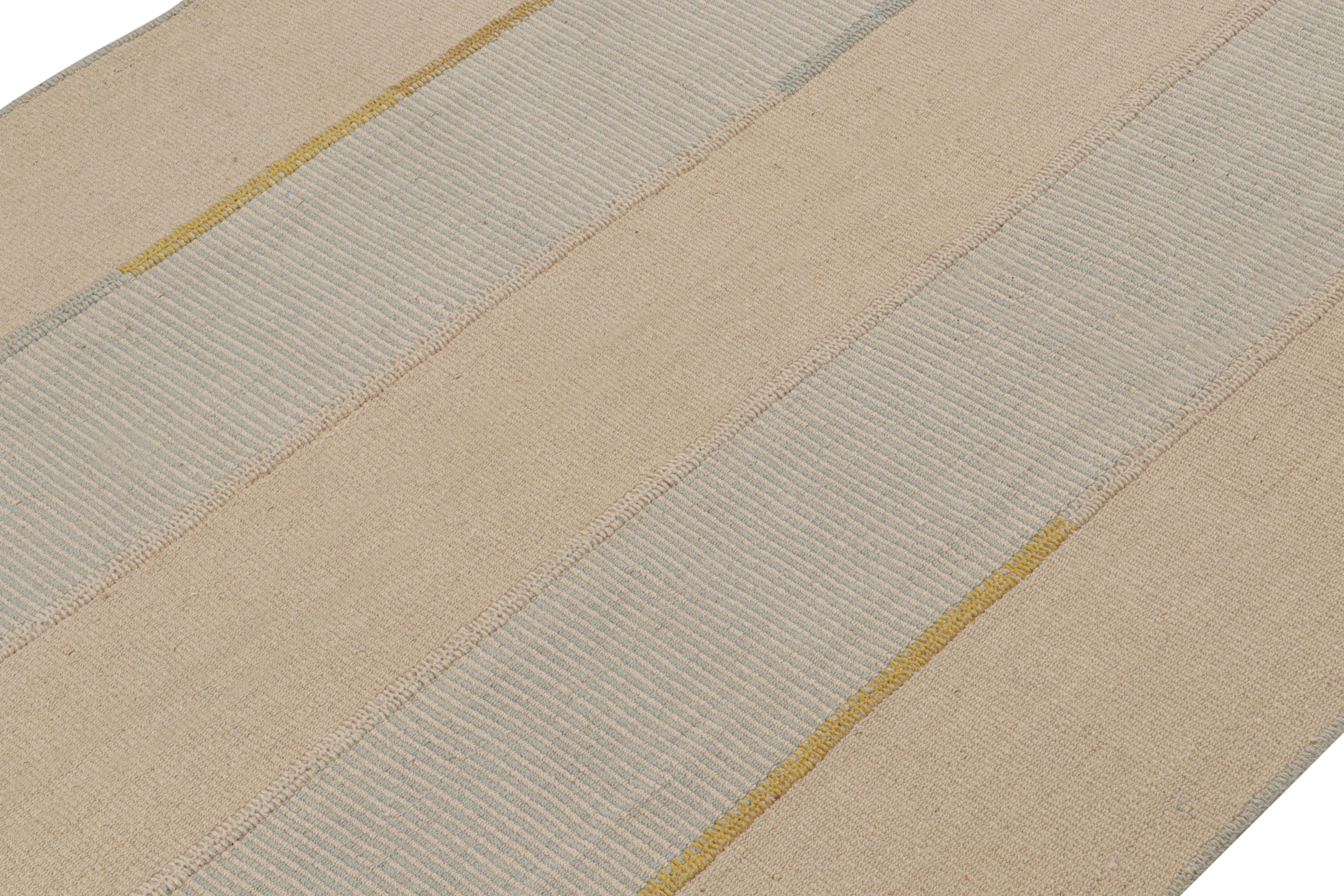 Handwoven in wool, this 7x9 Kilim os from a bold new line of contemporary flatweaves by Rug & Kilim.

On the Design: 

Connoting a modern take on Classic panel-weaving, our latest “Rez Kilim” enjoys beige, blue and gold tones with a cream