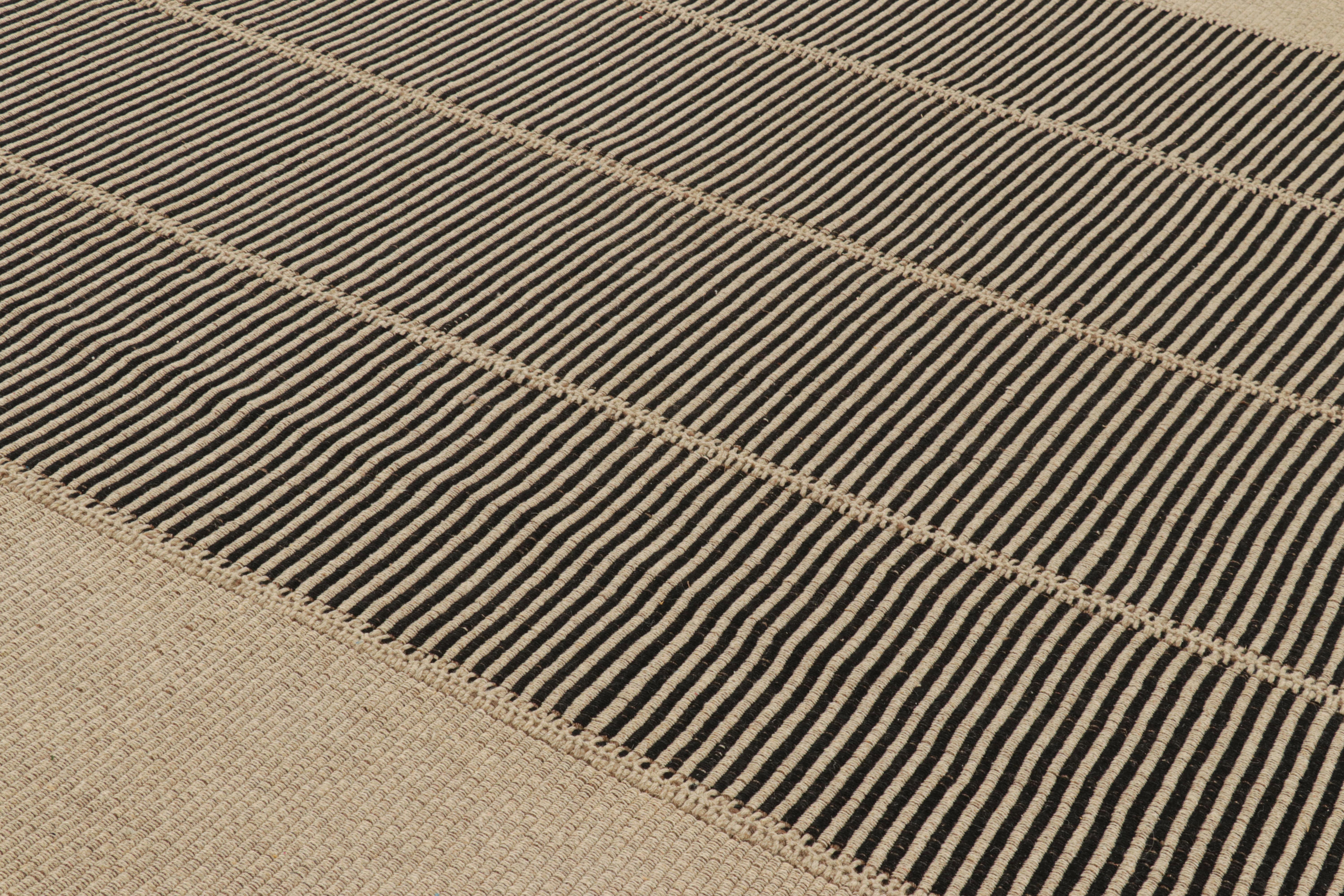 Handwoven in wool, a 10x14 Kilim design from an inventive new contemporary flat weave collection by Rug & Kilim.

On the Design: 

Fondly dubbed, “Rez Kilims”, this modern take on classic panel-weaving enjoys a fabulous, unique play of black and