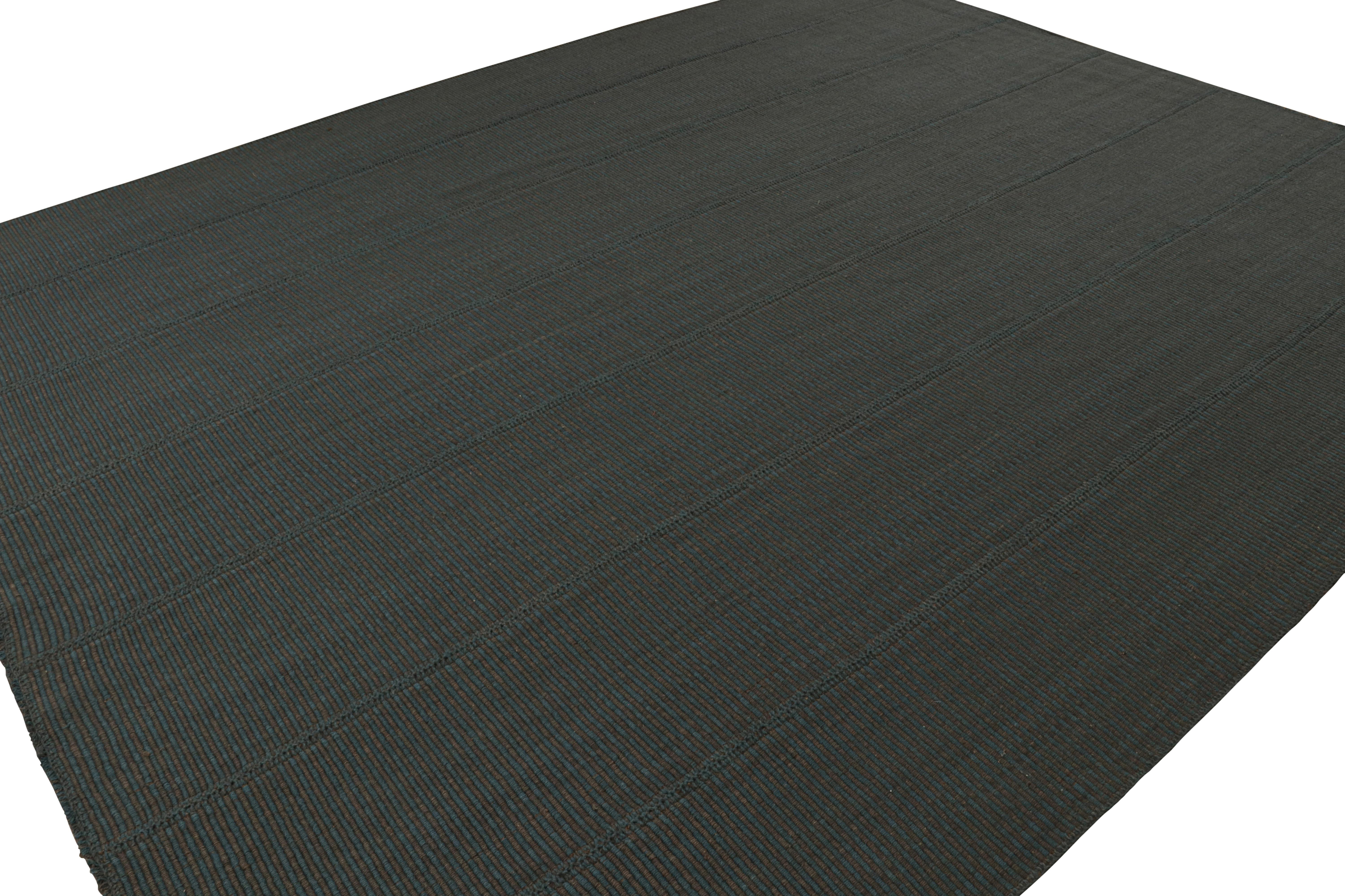 Handwoven in wool, a 11x14 Kilim in Black and Blue accents, from a bold new line of contemporary flatweaves, ‘Rez Kilim’, by Rug & Kilim.

On the design: 

Connoting a modern take on classic panel-weaving, our latest “Rez Kilim” enjoys black and