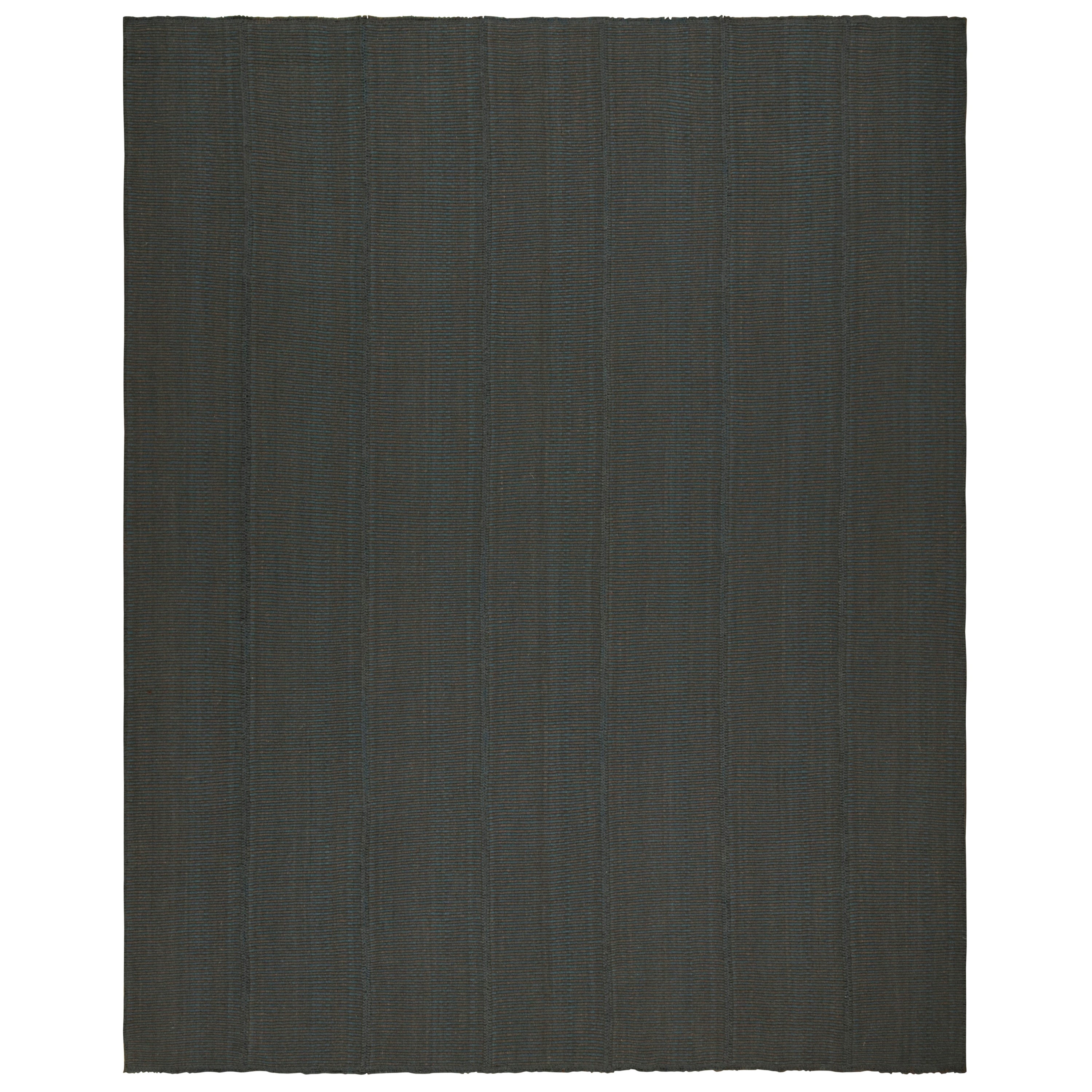 Rug & Kilim è un kilim contemporaneo di colore nero con accenti blu.