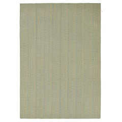 Rug 
Kilim è un kilim contemporaneo a strisce blu e beige.