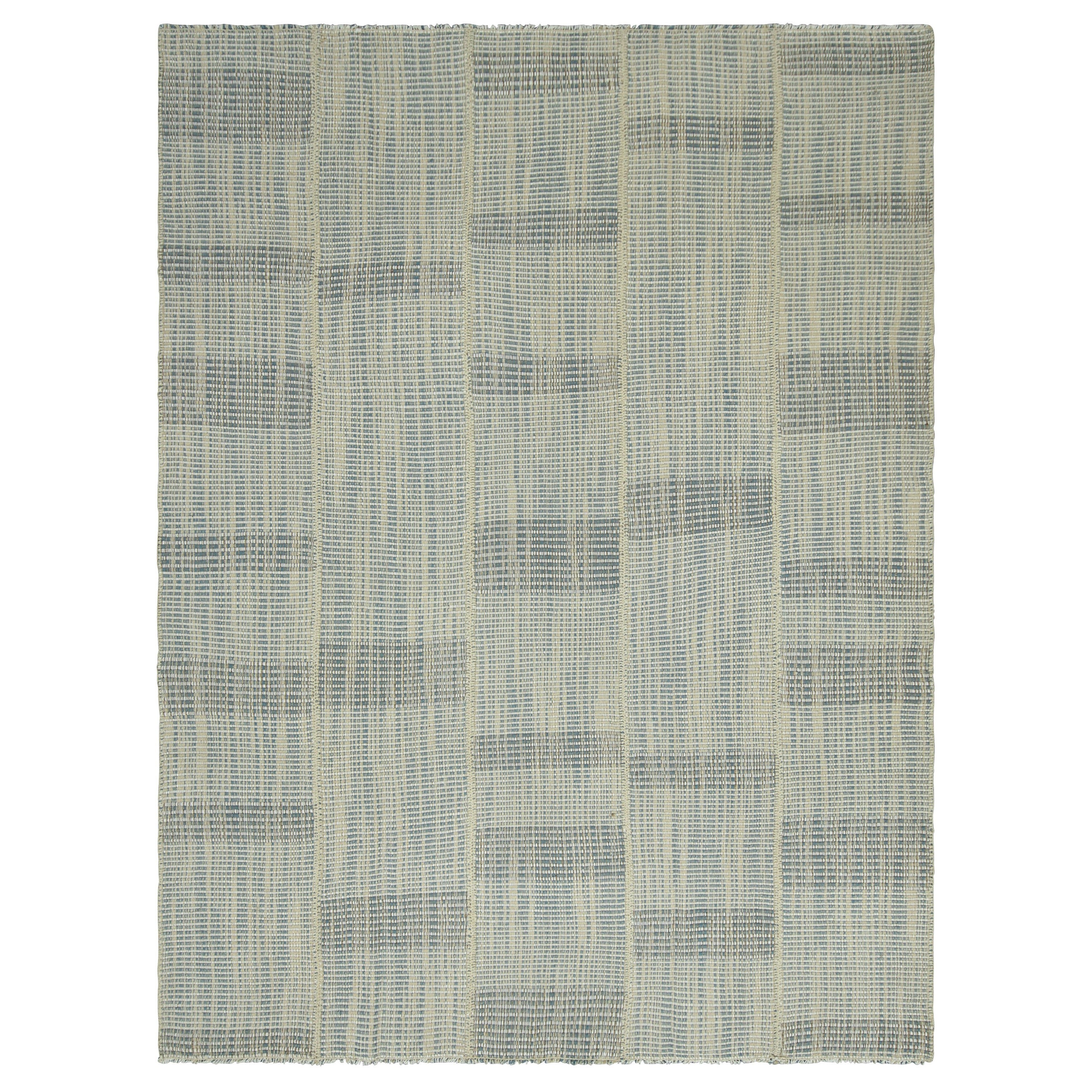 Rug 
Kilim è un kilim contemporaneo a strisce testuali bianche e blu.