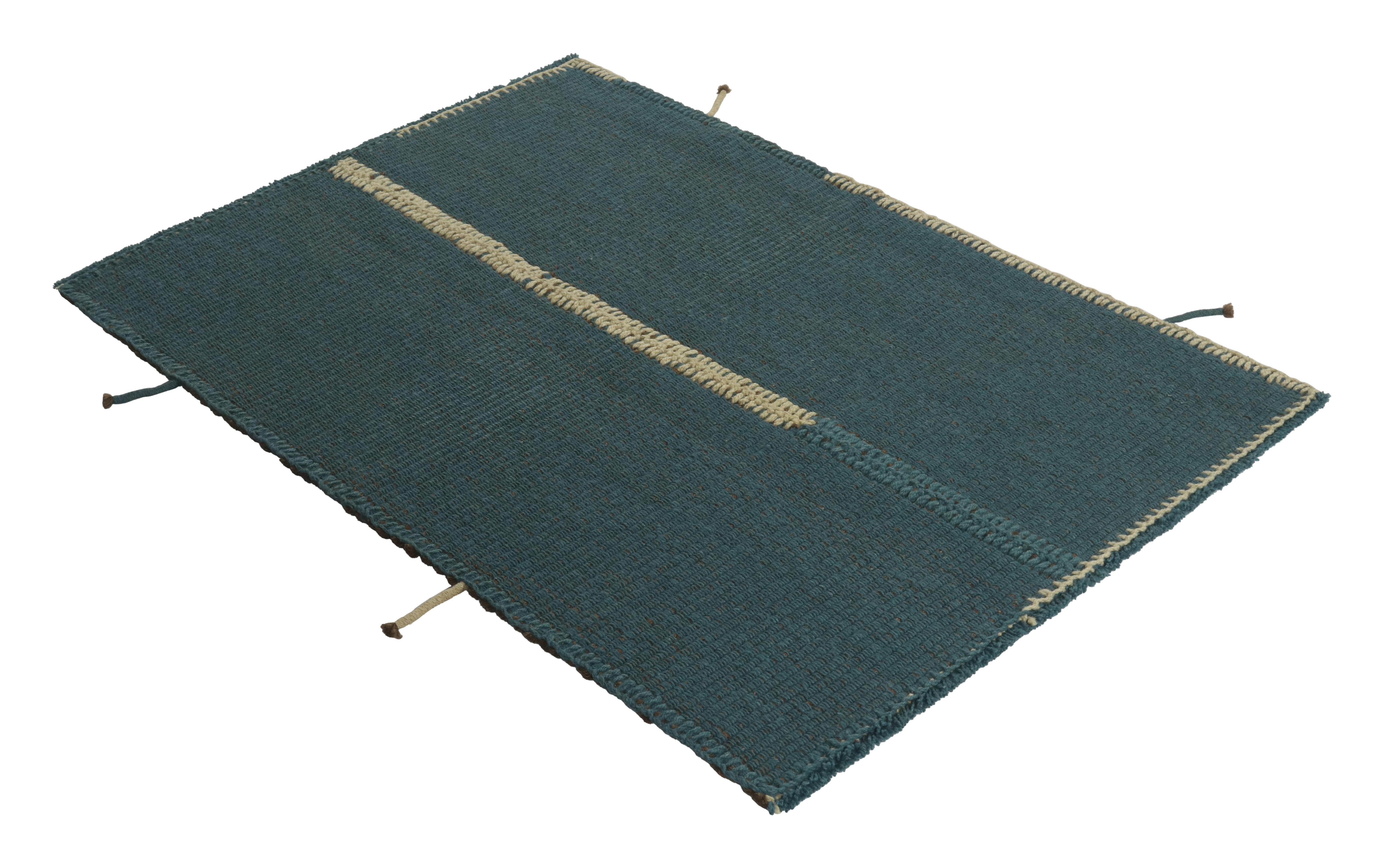 Handwoven in wool, a gift-sized 3x4 Kilim from an innovative new contemporary flat weave collection by Rug & Kilim.
On the Design:
“Rez Kilim” connotes a modern take on classic panel weaving—this edition enjoying an almost ocean blue with brown