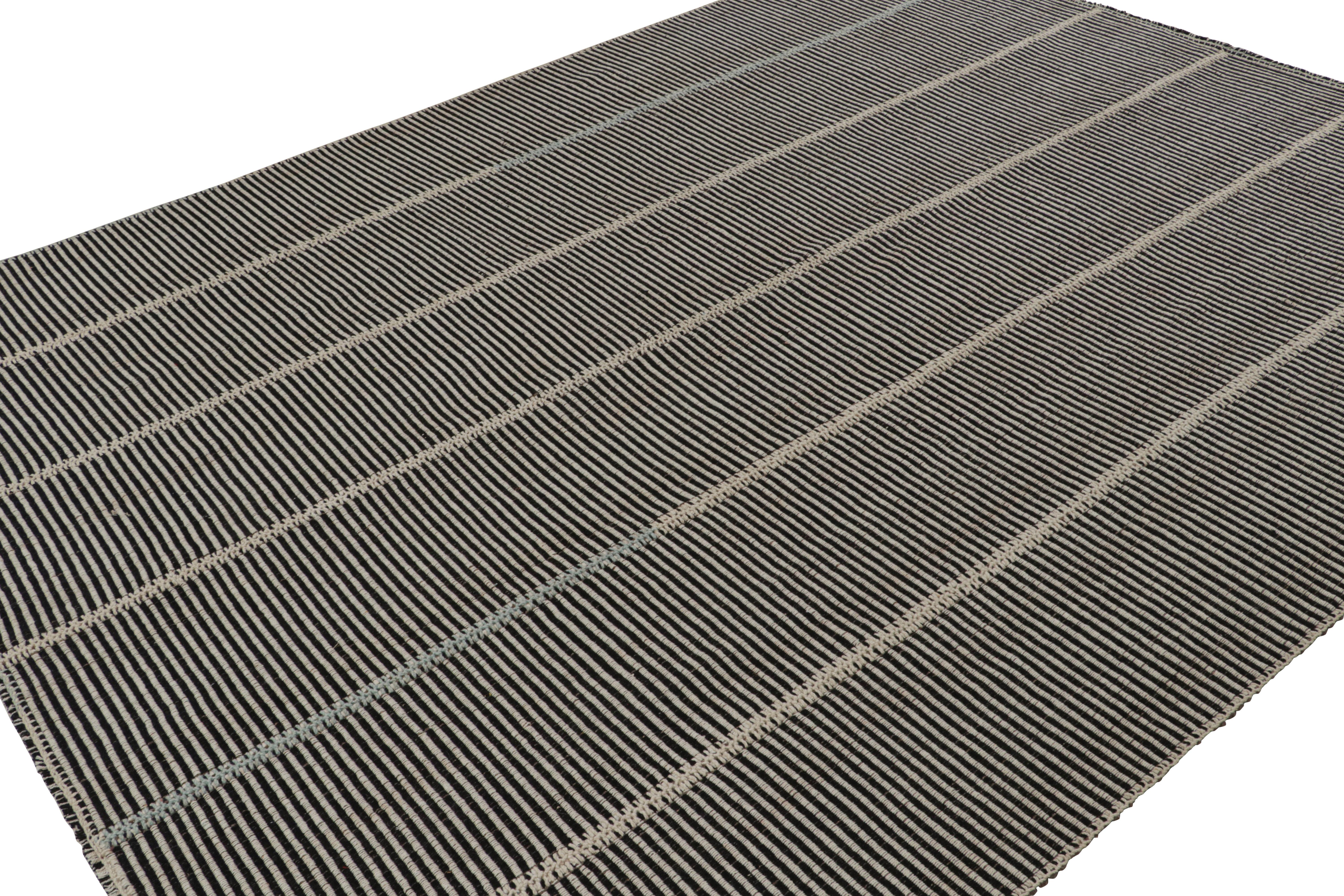Handwoven in wool, a 9x12 Kilim in Brown with Beige and Blue  accents, from a bold new line of contemporary flatweaves, ‘Rez Kilim’, by Rug & Kilim.

On the Design: 

Connoting a modern take on classic panel-weaving, our latest “Rez Kilim” enjoys