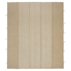 Rug 
Kilim è un kilim contemporaneo a strisce color crema, bianco e beige.