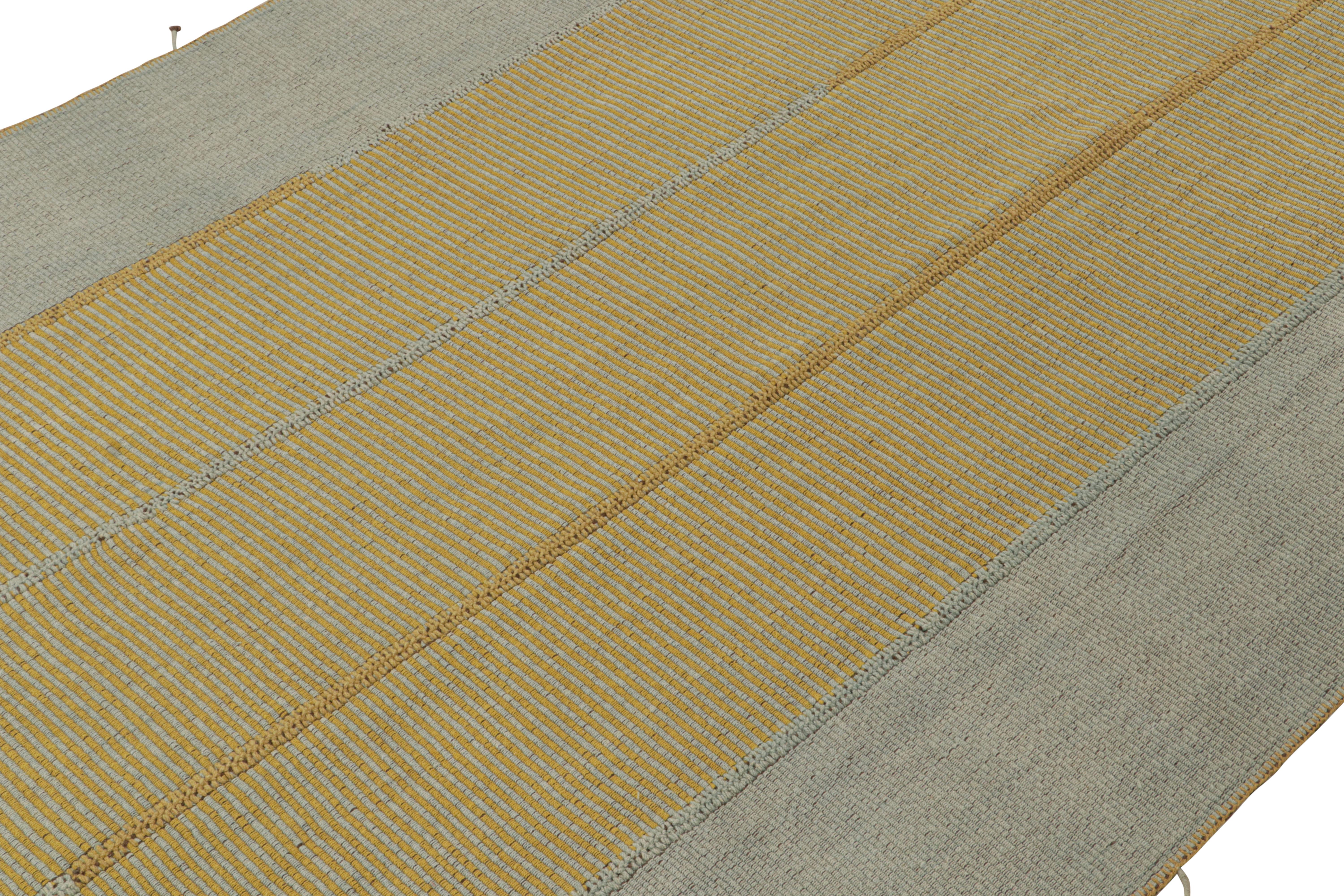 Handwoven in wool, a 9x12 Kilim from a bold new line of contemporary flatweaves by Rug & Kilim.

On the Design: 
Connoting a modern take on Classic panel-weaving, our latest “Rez Kilim” enjoys blue and gold with rich brown accents. Keen eyes will
