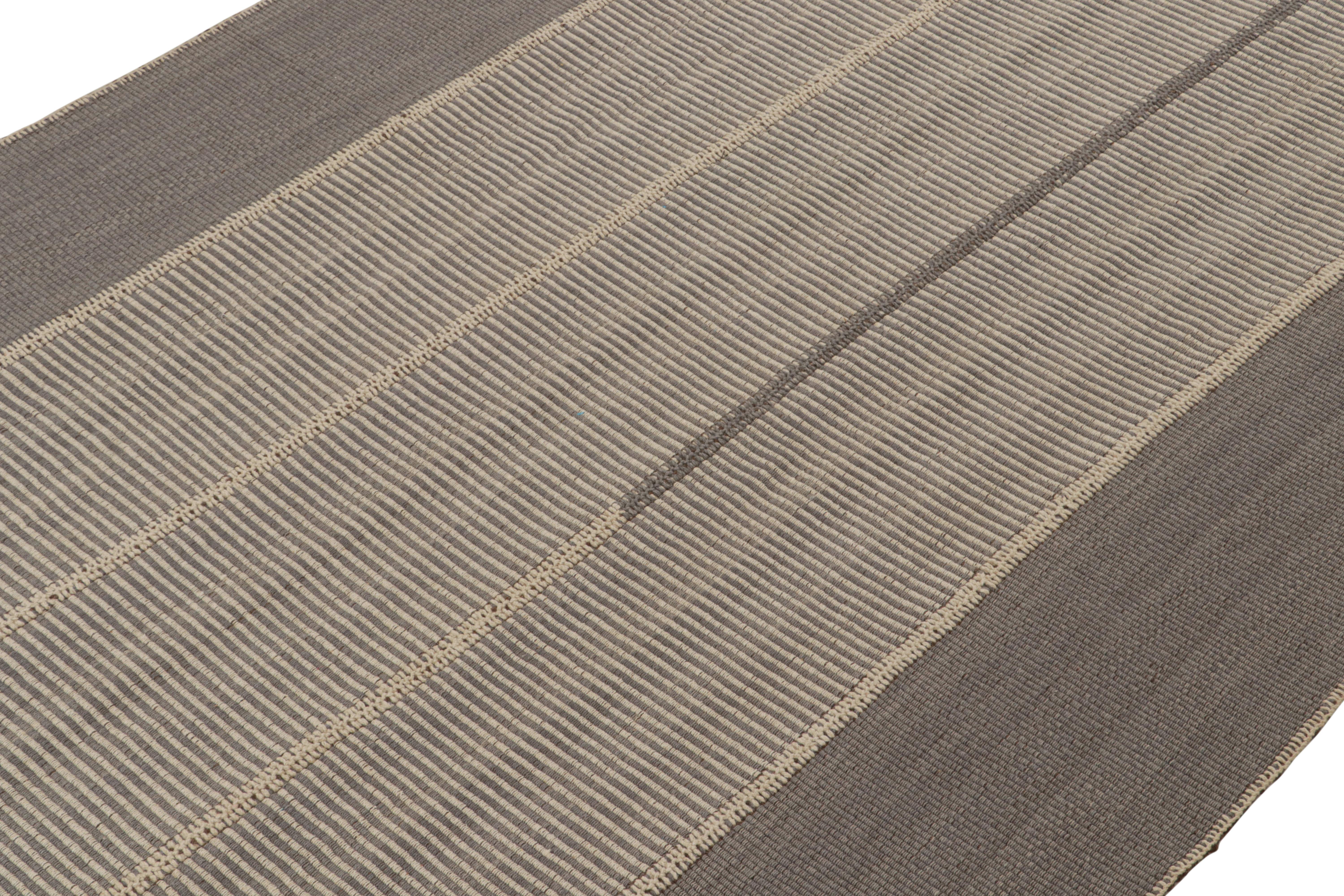 Handwoven in wool, a 9x12 Kilim from a bold new line of contemporary flatweaves by Rug & Kilim.

On the Design: 

Connoting a modern take on classic panel-weaving, our latest “Rez Kilim” enjoys gray and beige with rich brown undertones. Keen eyes