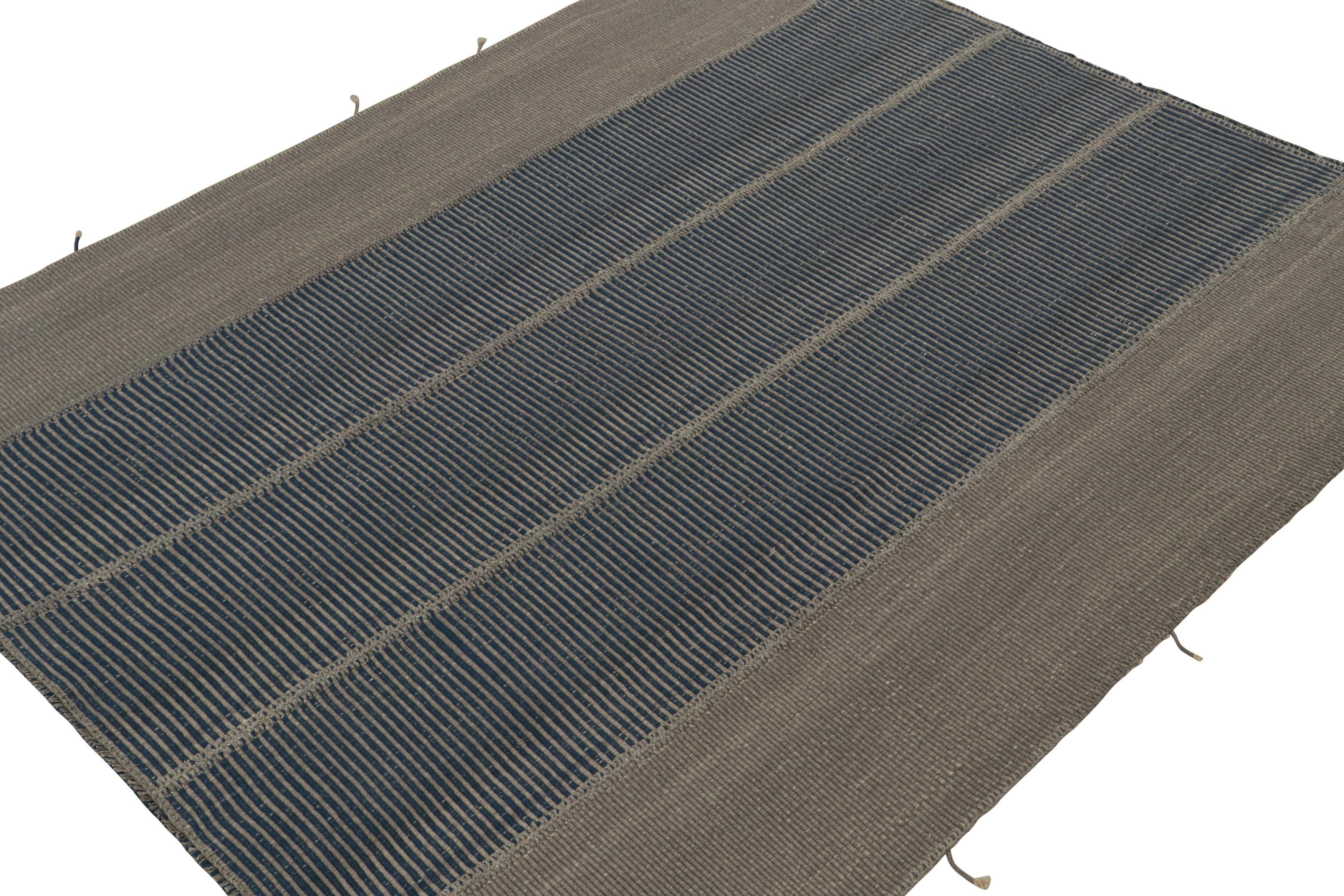 Handwoven in wool, a 8x10 Kilim in gray and blue accents, from a bold new line of contemporary flatweaves, ‘Rez Kilim’, by Rug & Kilim.

On the design: 

Connoting a modern take on classic panel-weaving, our latest “Rez Kilim” enjoys gray and blue