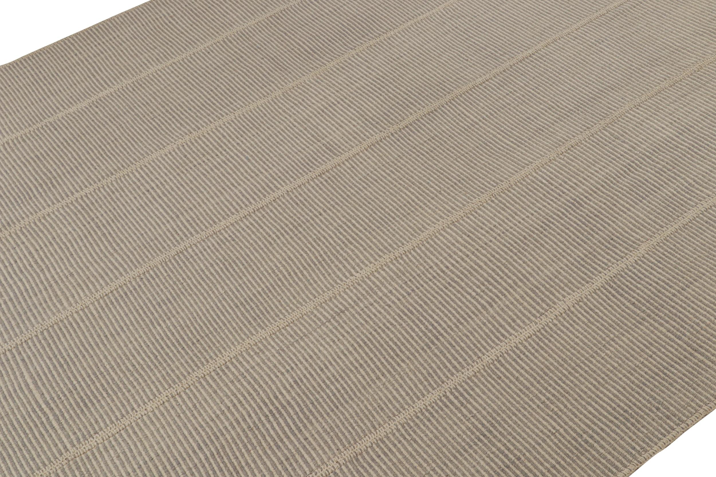 Handwoven in wool, a 10x14 Kilim from a bold new line of contemporary flatweaves by Rug & Kilim.

On the Design: 

Connoting a modern take on classic panel-weaving, our latest “Rez Kilim” enjoys cream & Gray tones. Keen eyes will admire how this