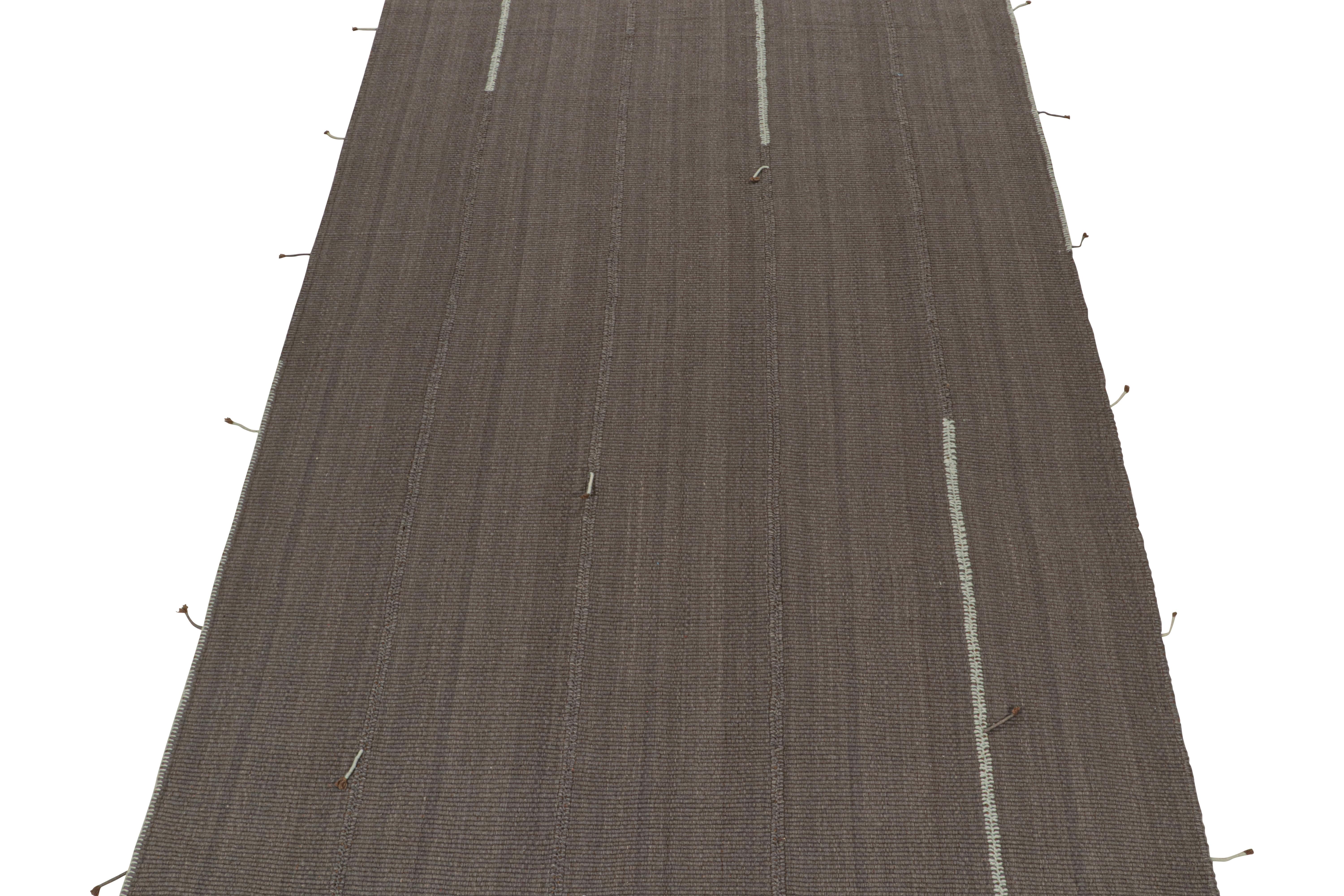 Handwoven in wool, this 8x12 Kilim is from a bold new line of contemporary flatweaves by Rug & Kilim.

Further on the design:

The “Rez Kilim” connotes a modern take on Classic panel weaving. This particular rug enjoys stripes in 
slate gray with