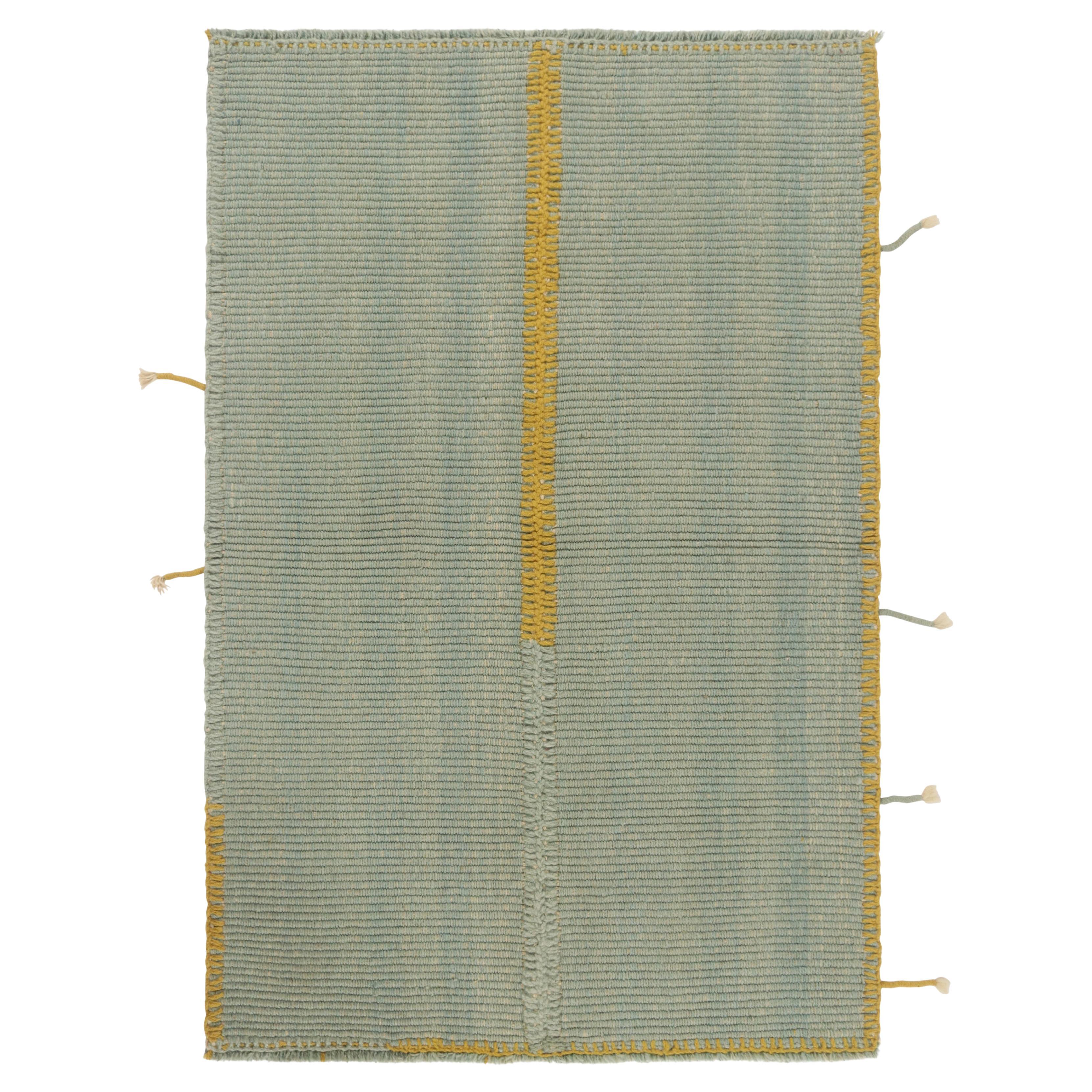 Rug & Kilim’s Contemporary Kilim in Light Blue with Ochre Accents