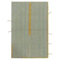 Rug & Kilim’s Contemporary Kilim in Light Blue with Ochre Accents