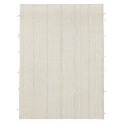 Rug 
Kilim è un kilim contemporaneo a strisce beige-marrone e bianco crema.