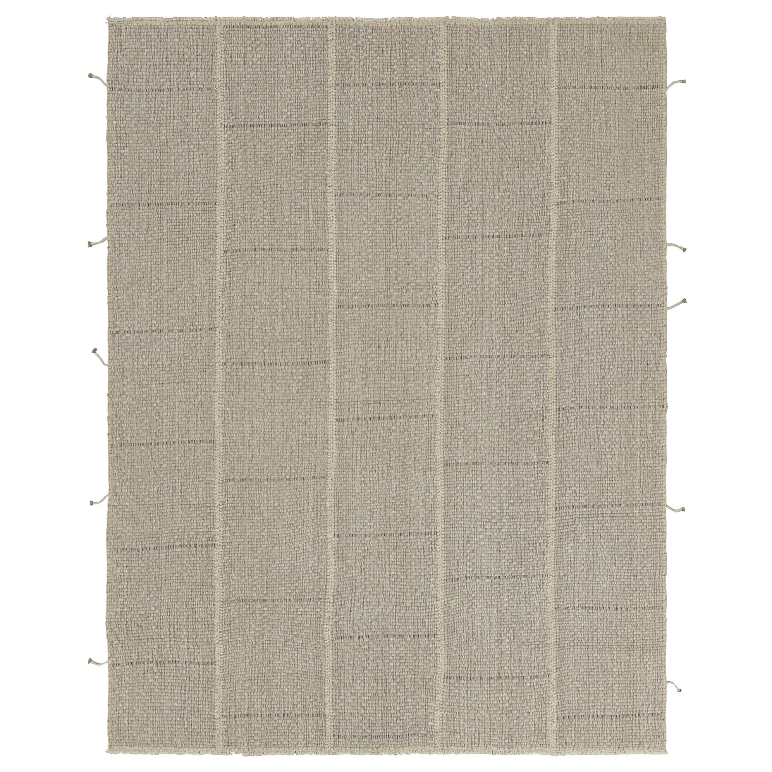 Rug
Kilim è un kilim contemporaneo a strisce beige-marrone con accenti crema.