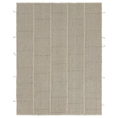 Rug
Kilim è un kilim contemporaneo a strisce beige-marrone con accenti crema.