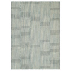 Rug 
Kilim è un kilim contemporaneo a strisce blu e bianco panna.