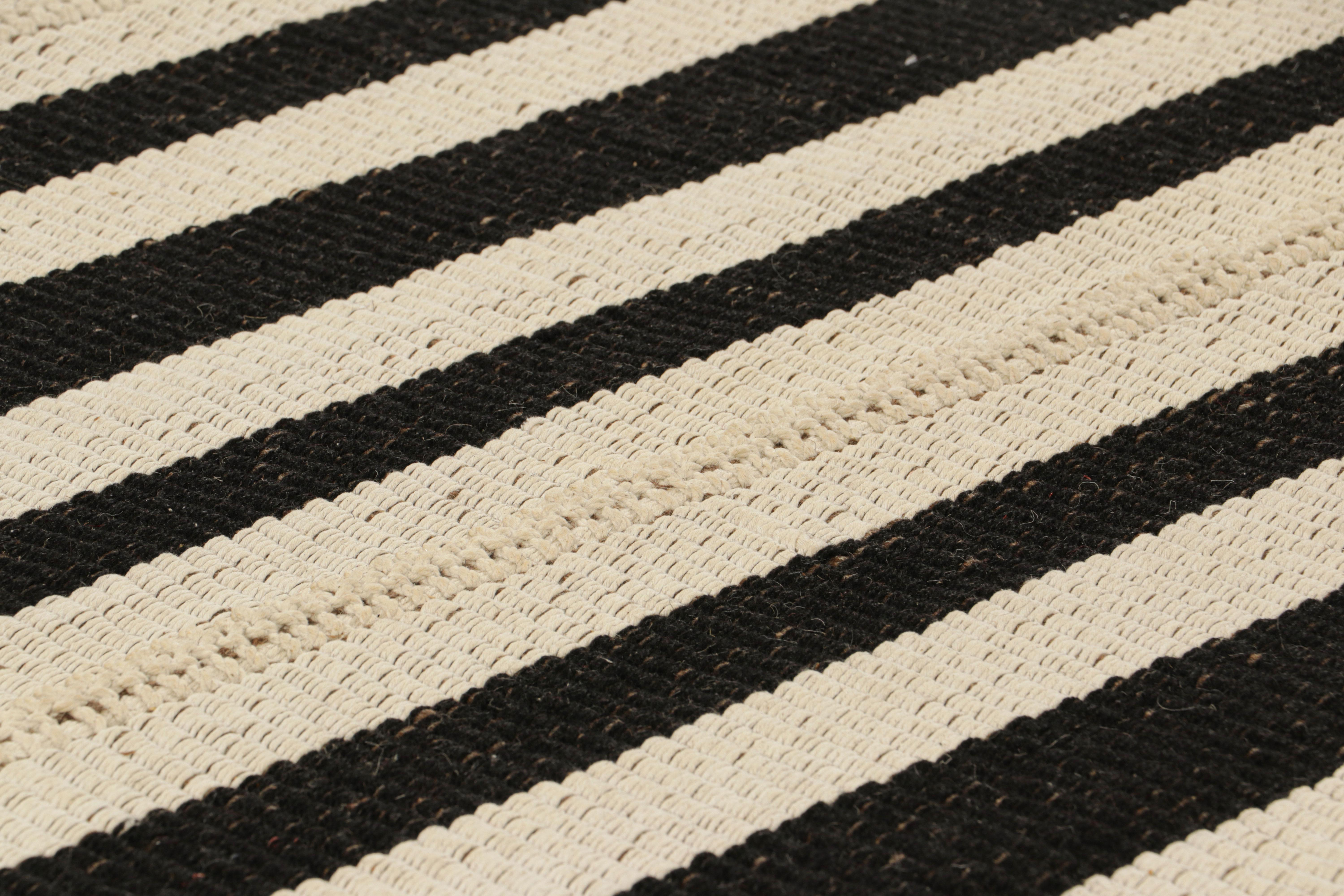Handwoven in wool, this 10x14 Kilim is from an inventive new contemporary flat weave collection by Rug & Kilim.

On the Design: 

Fondly dubbed, “Rez Kilims”, this modern take on classic panel-weaving enjoys a fabulous, unique play of black and