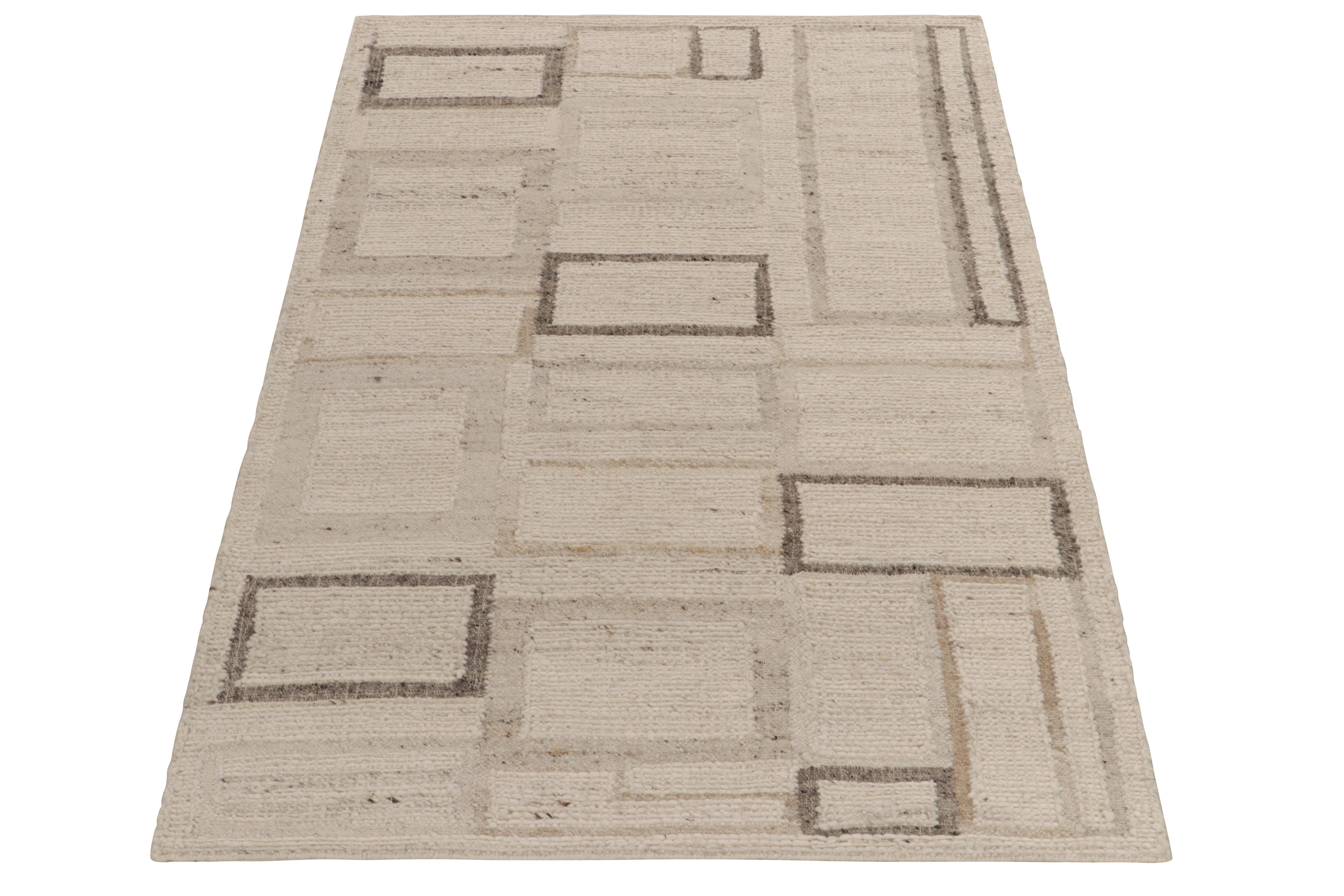 Rug & Kilim presents a bold contemporary take on Art Deco aesthetics with this 5x8 handspun Kilim. The flat weave rug features a modern geometric pattern in a comforting beige-brown colorway—the striations born of the handspinning technique enjoying