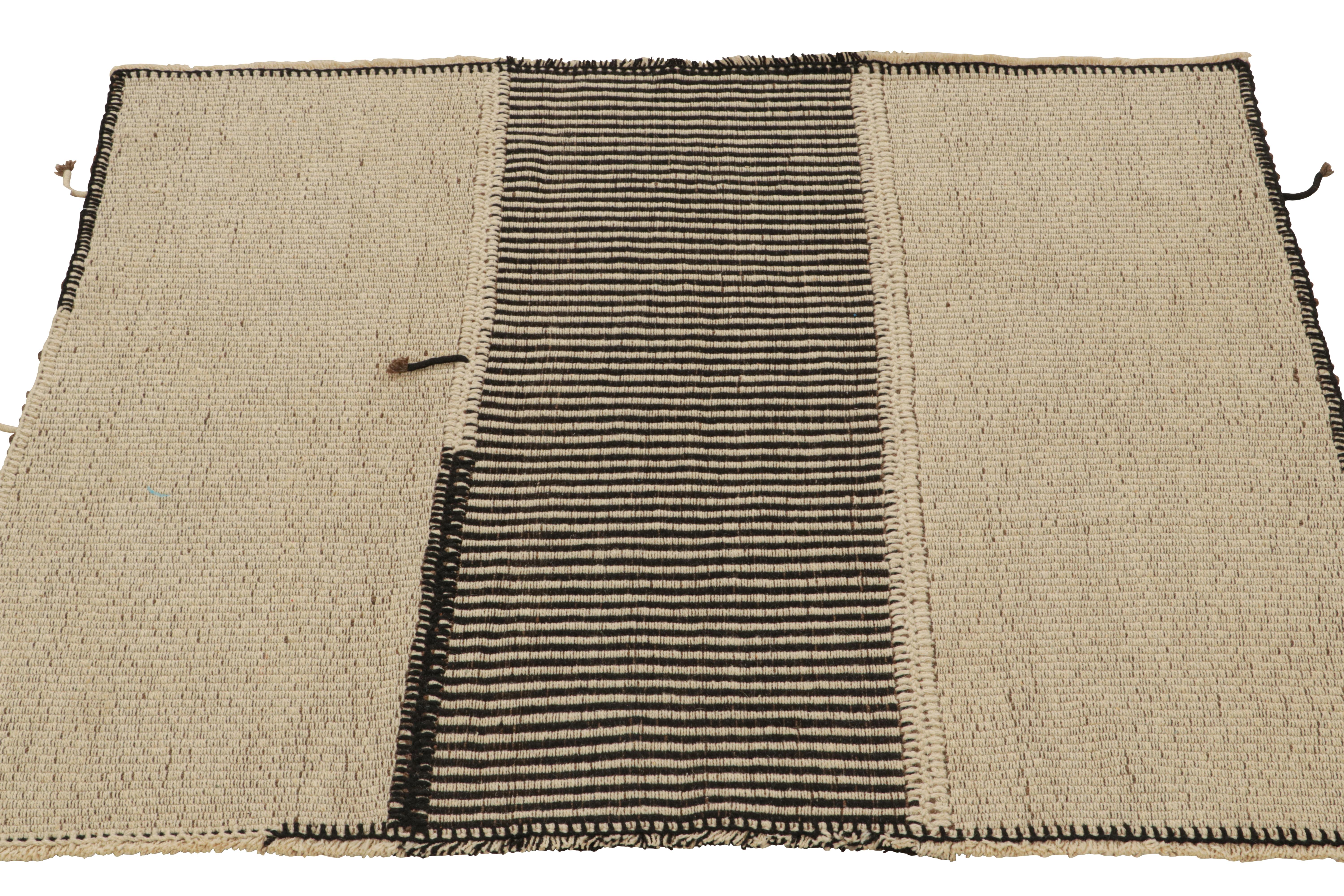 Handwoven in wool, this square 5x5 Kilim is from a bold new line of contemporary flatweaves by Rug & Kilim.

Further On the Design:

The “Rez Kilim” connotes a modern take on classic panel weaving. This edition enjoys beige with rich brown and