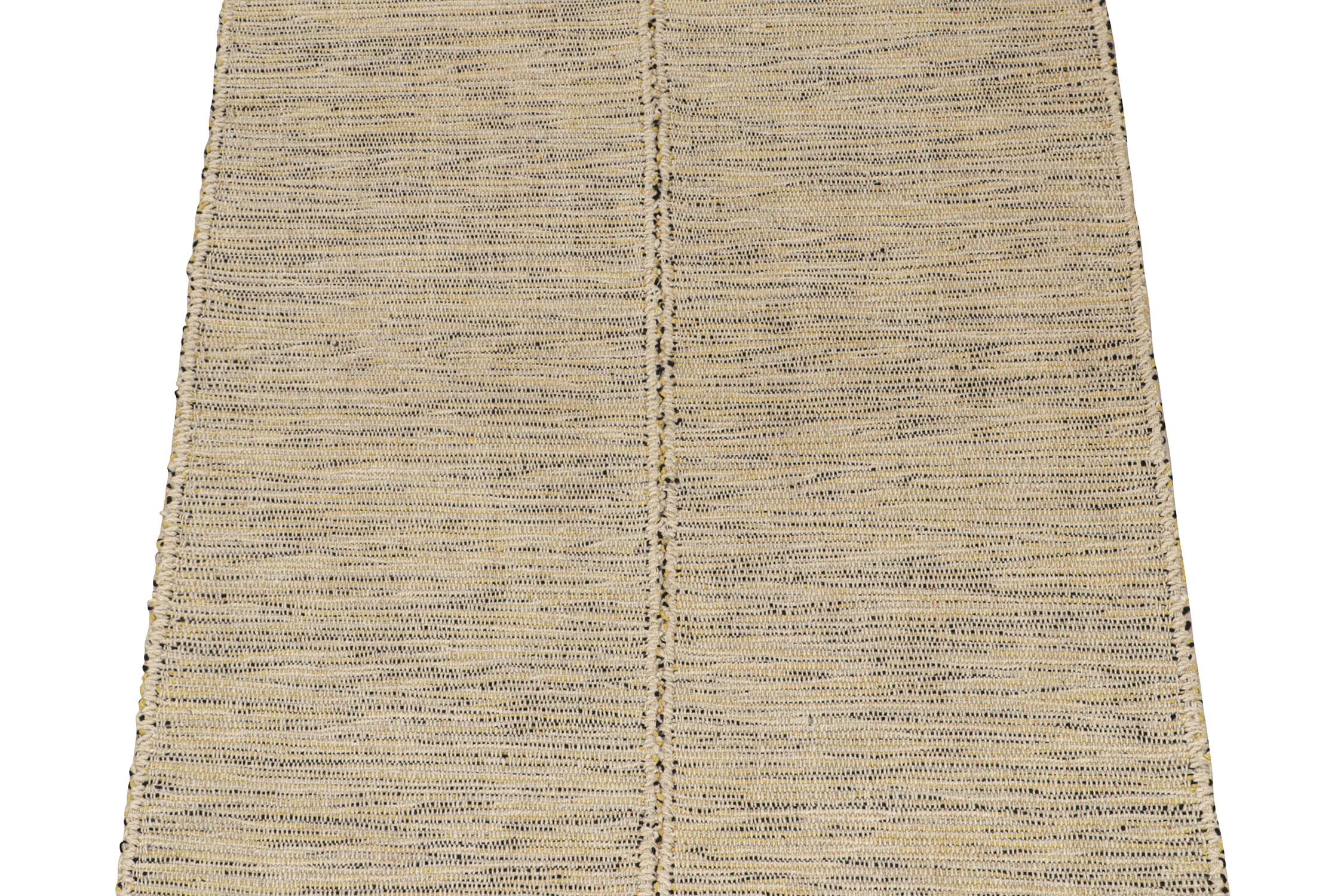 Handwoven in wool, this 4x5 Kilim is from a bold new line of contemporary flatweaves by Rug & Kilim.
Further on the Design:

The “Rez Kilim” connotes a modern take on classic panel weaving. This edition enjoys comfortable tones of beige with yellow