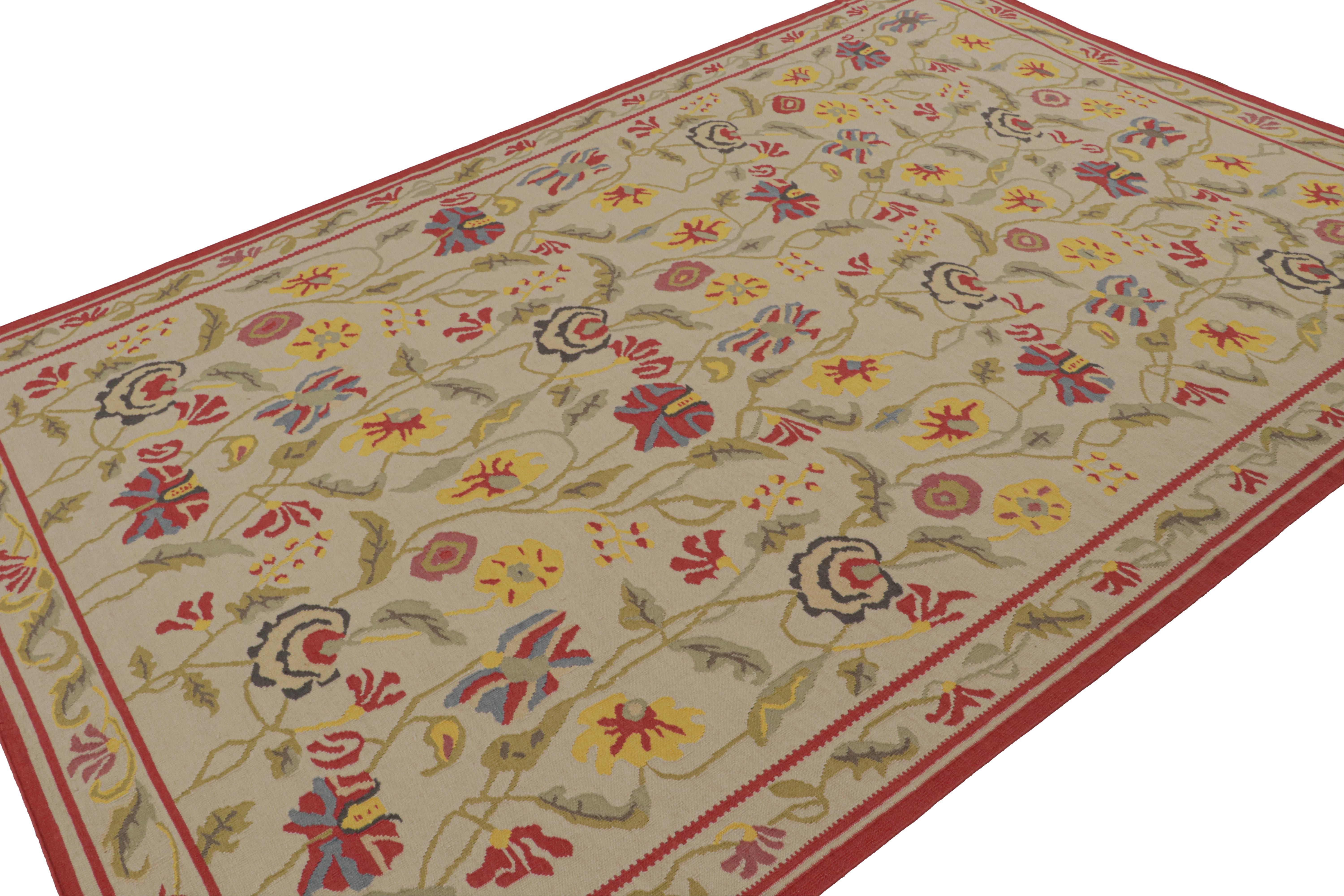 Hand-knotted in wool, this 7x9 contemporary kilim rug with floral patterns across the field has been inspired by rural Oriental flatweaves of Persian and Indian sensibility. 

On the Design: 

Resembling a modern take on vintage Indian Dhurrie