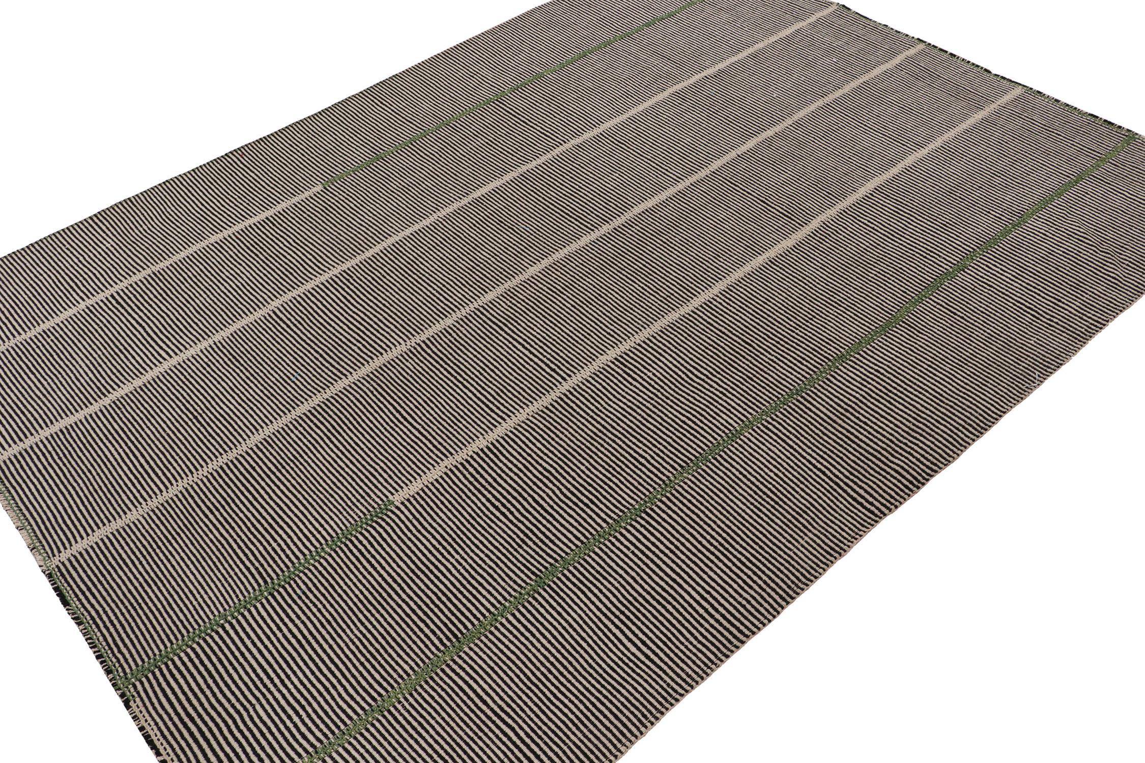 Handwoven in wool, this 10x13 Kilim is from a bold new line of contemporary flatweaves by Rug & Kilim.

Further On the Design:

The “Rez Kilim” connotes a modern take on classic panel weaving. This edition enjoys a play of black and beige stripes